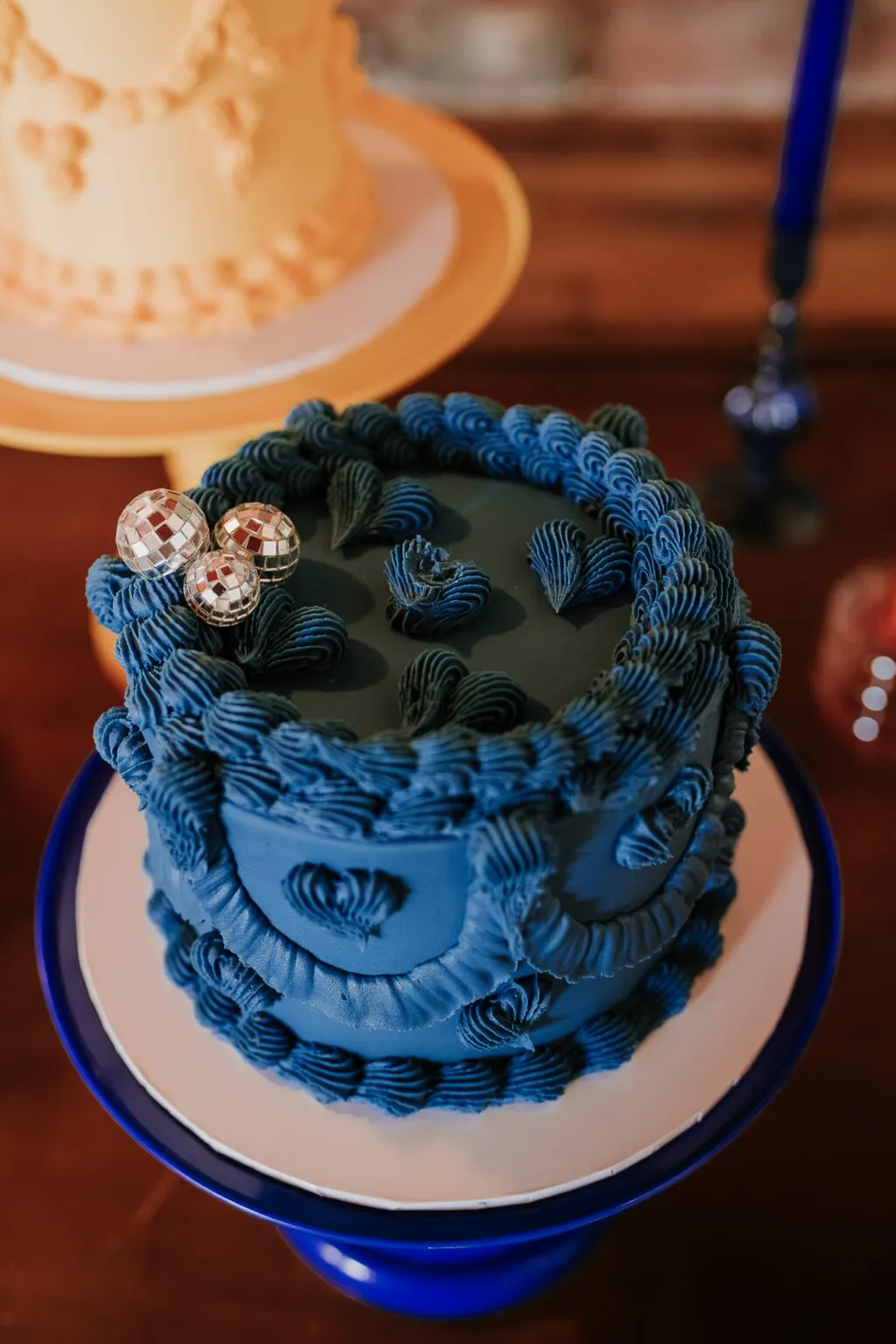 Blue sticky toffee Lambeth wedding cake decorated with disco balls