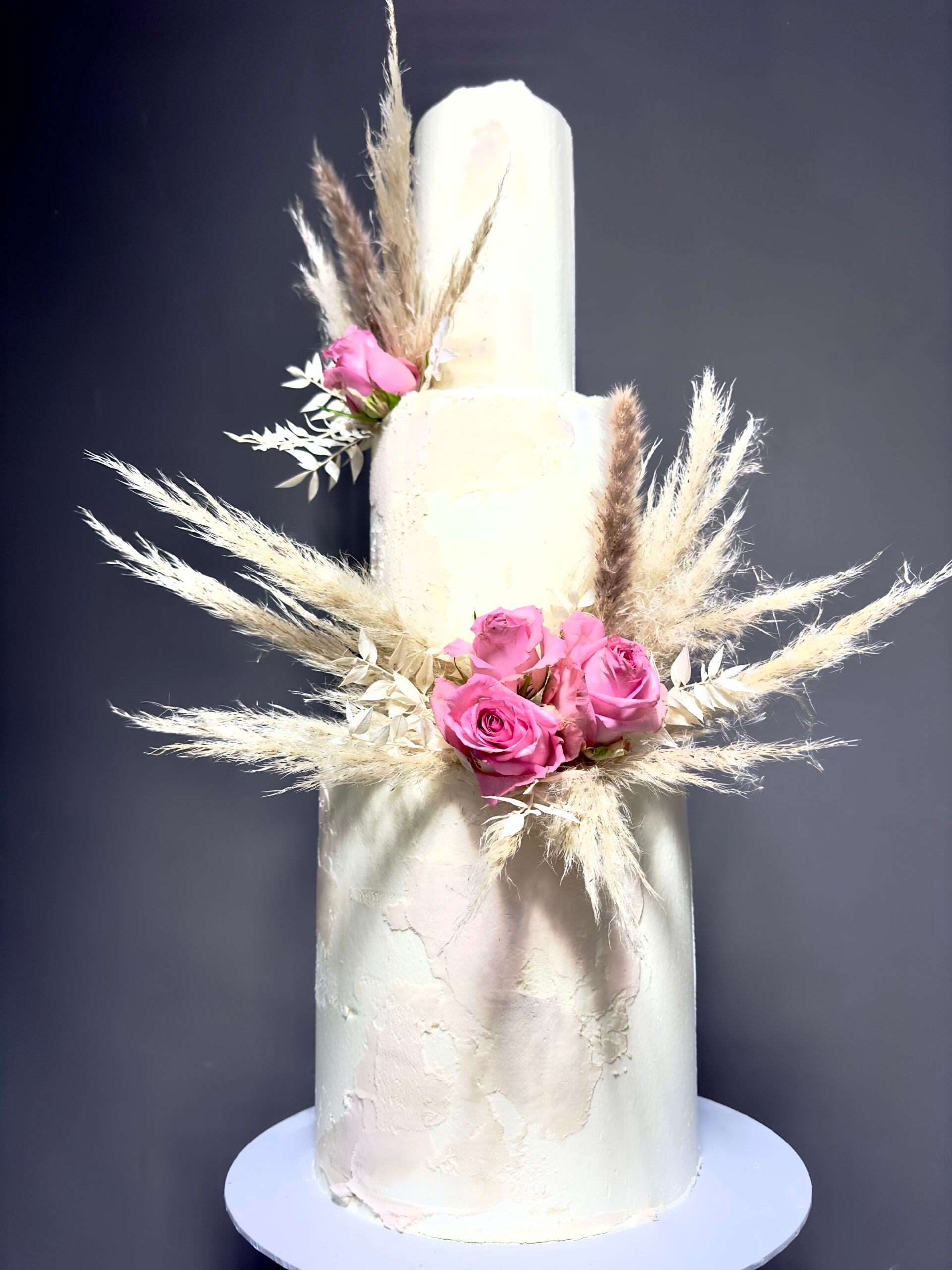 Wedding cake finished with bold statement blooms