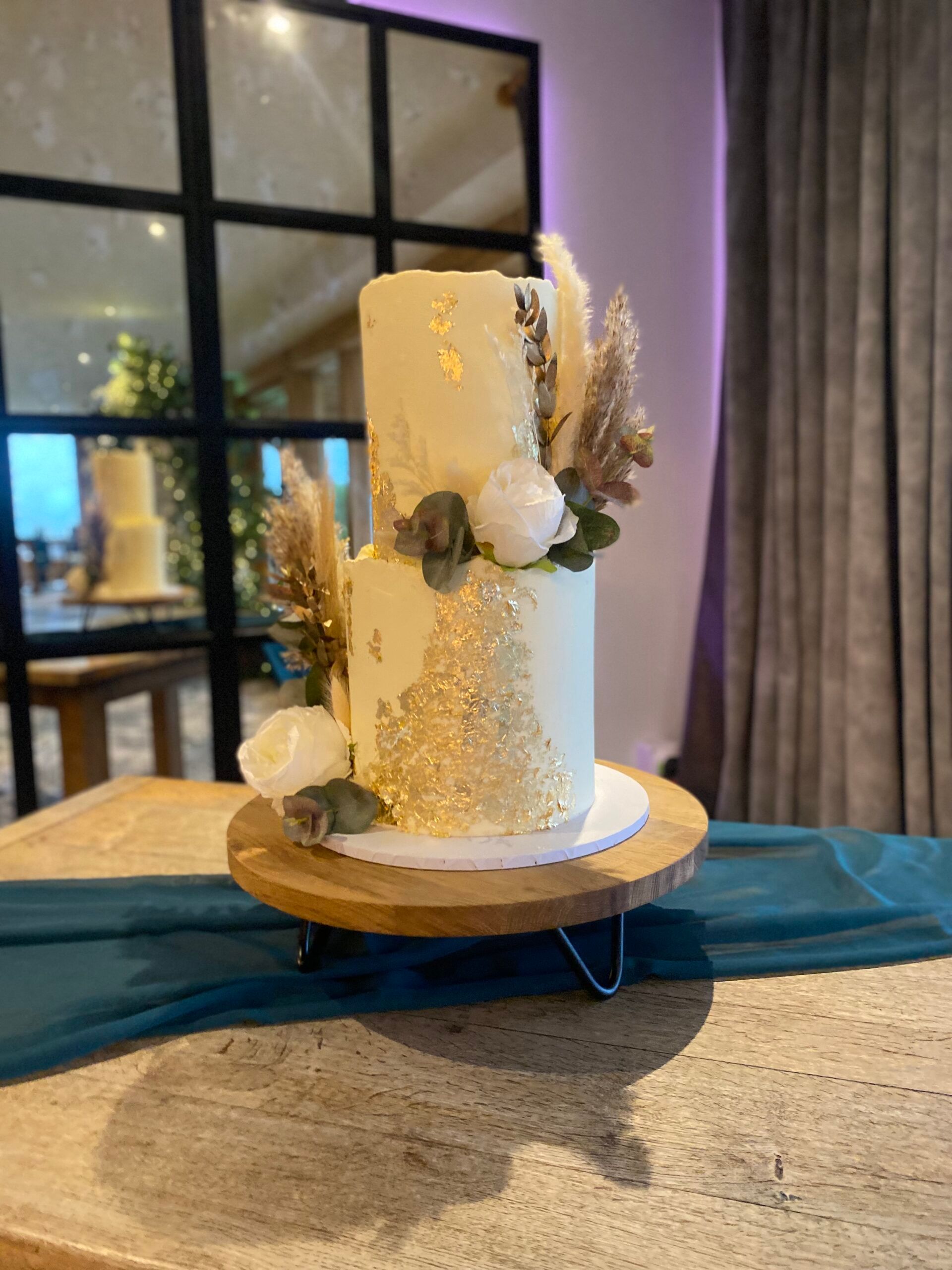 Garden-style wedding cake with abundant fresh flowers