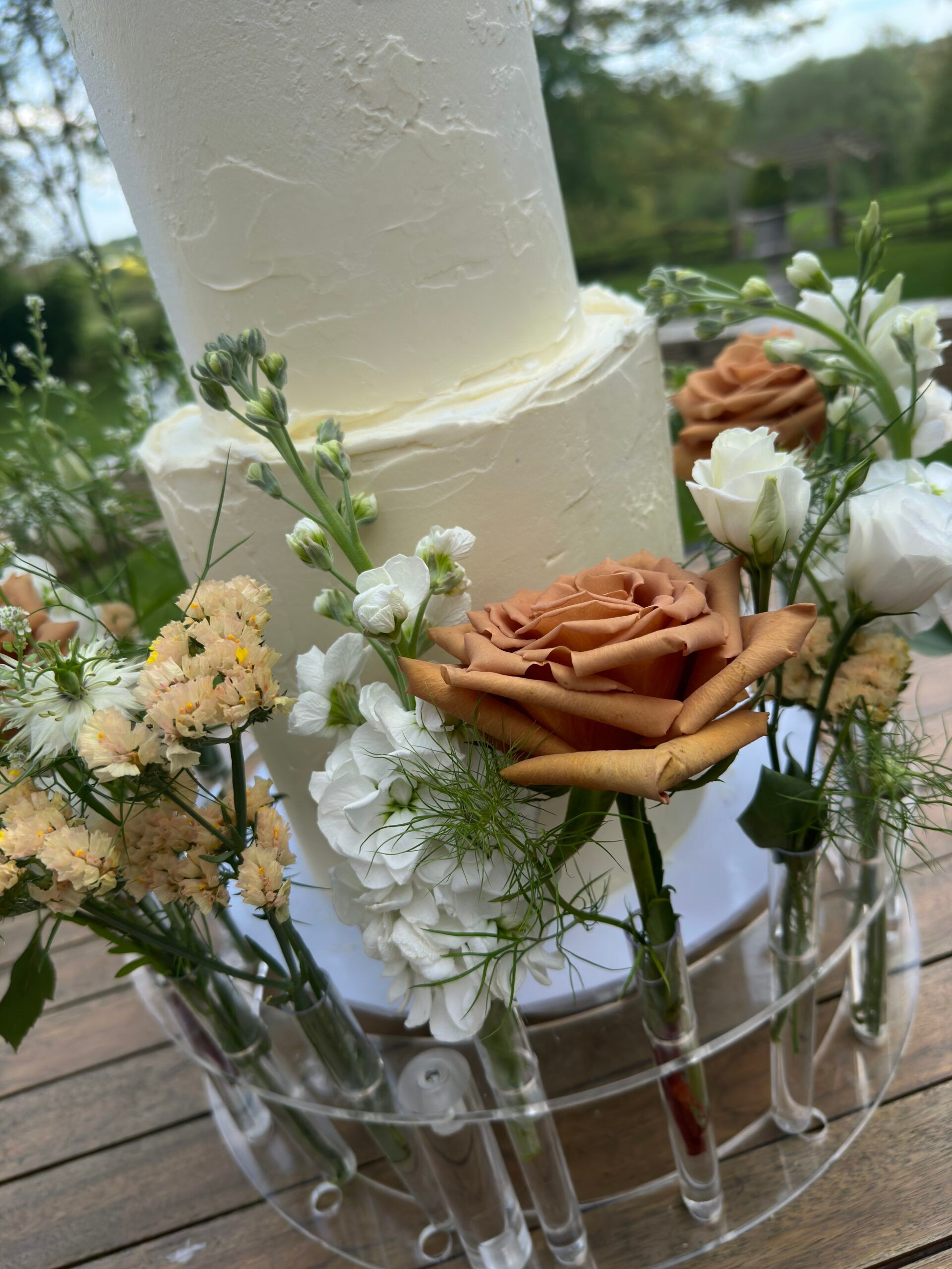 Romantic multi-tier wedding cake with soft floral detailing