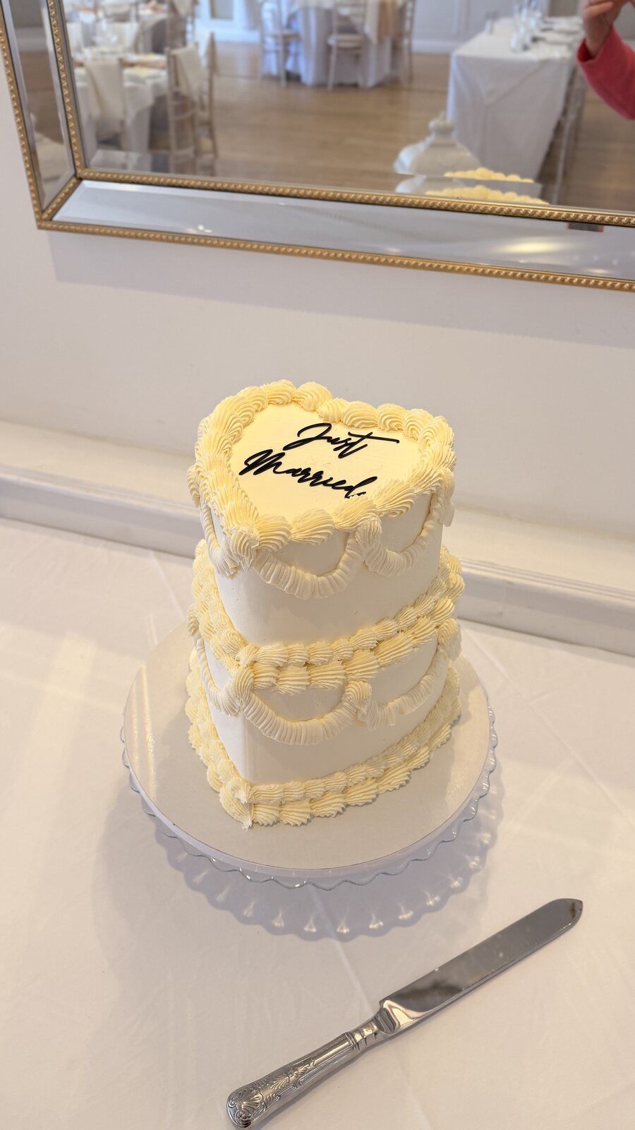 Two tier heart-shaped wedding cake with buttery Lambeth piping and piped 'Just Married' lettering