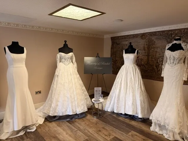 Wedding gowns from Flutterby Bridal Boutique displayed on mannequins