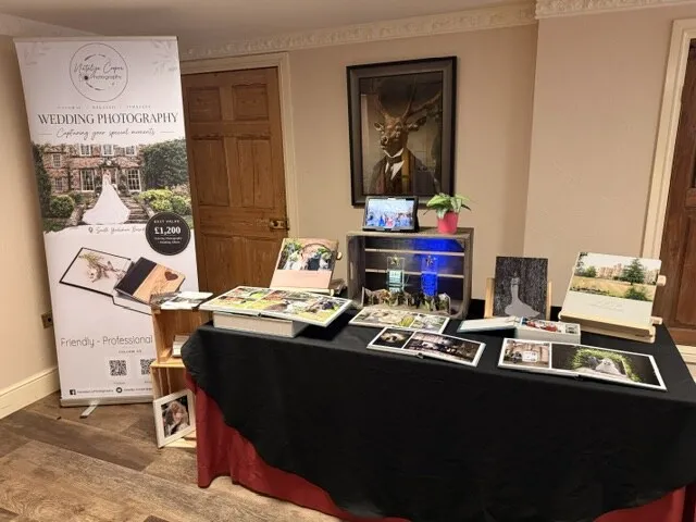 Natalija Cooper Photography’s display of wedding albums and prints