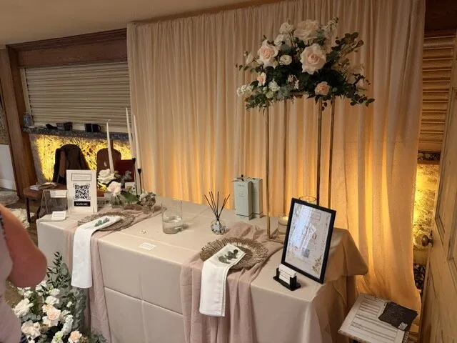 Elegant table styling with a tall floral arrangement on display at the fair